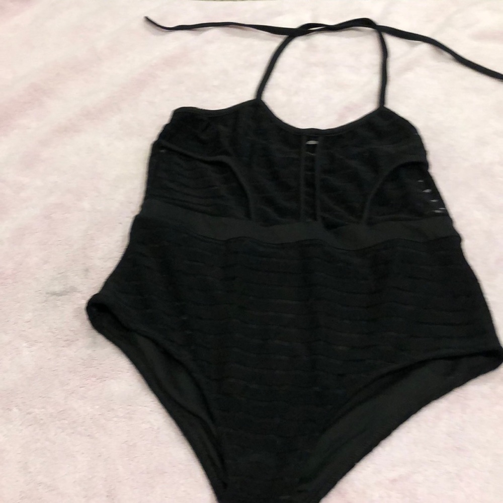 Black one piece size M, fits like a S